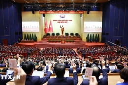 Los delegados votan para aprobar la Resolución del XIV Congreso Nacional del PCV (Foto: VNA)